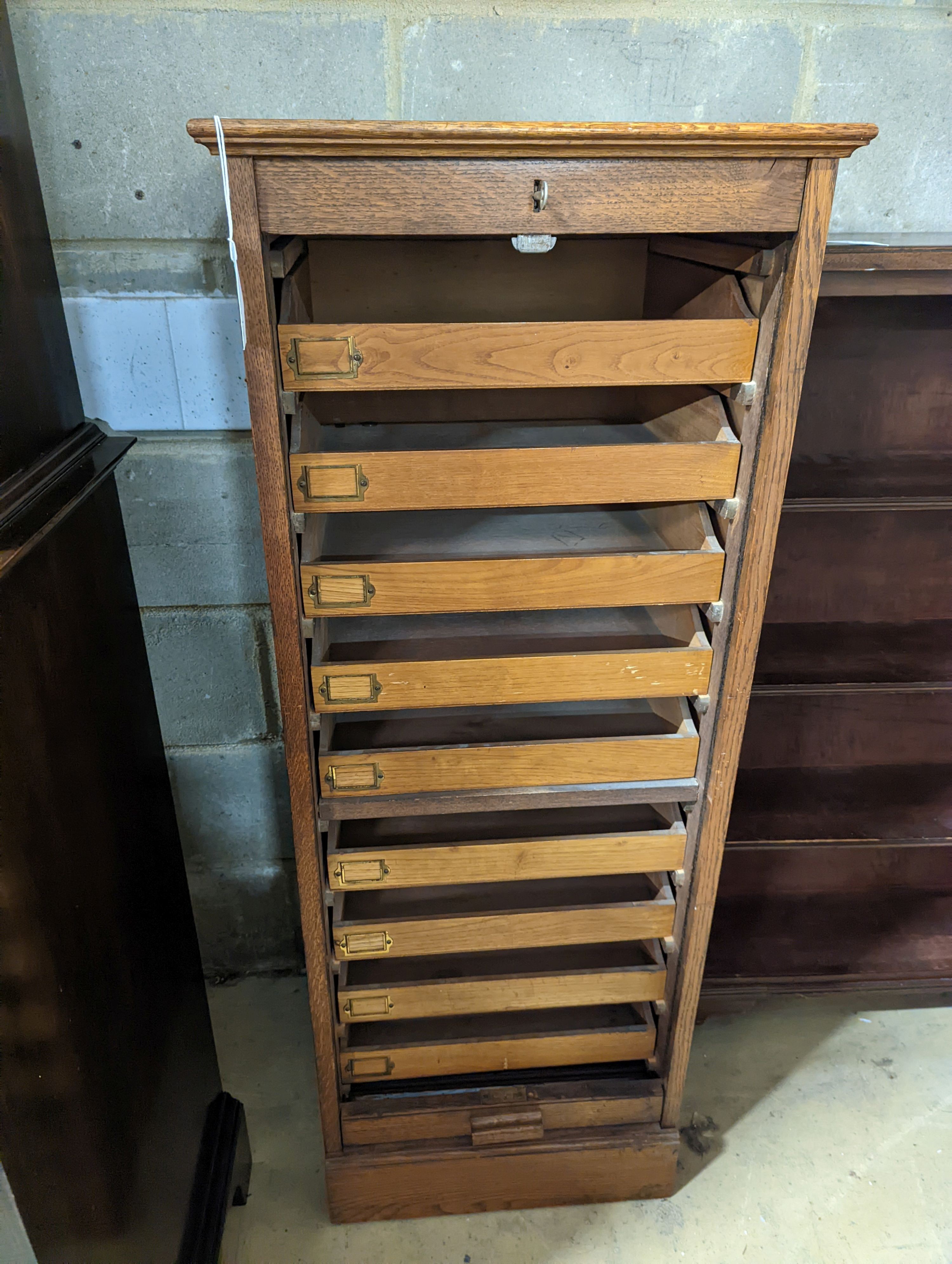 An early 20th century oak tambour filing cabinet, width 49cm, depth 40cm, height 125cm